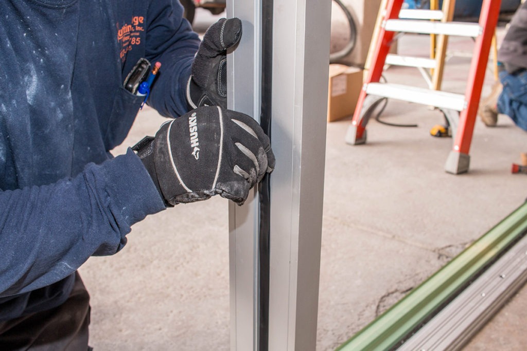 Close-up Vinyl Seal Installation - Family Dollar Commercial Storefront Installation