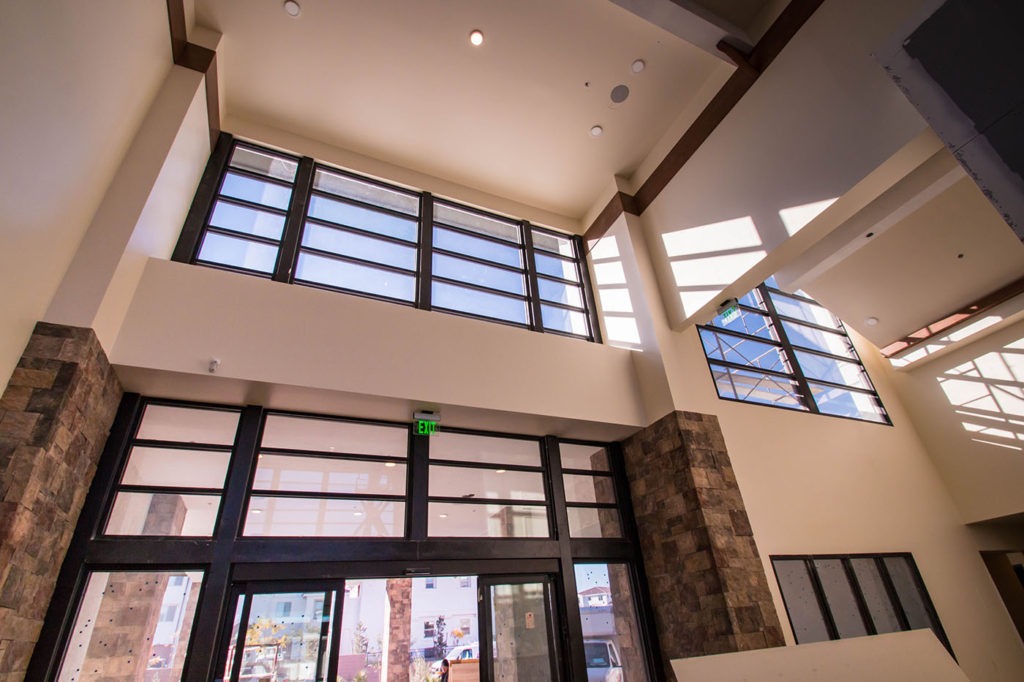 Beautiful Light Airy Glass Entryway - Castile Apartments - Storefront with Break Metal Cladding
