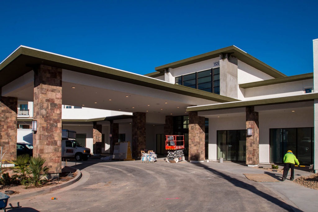 Front of Castile Apartments Retirement Community Covered Drive way