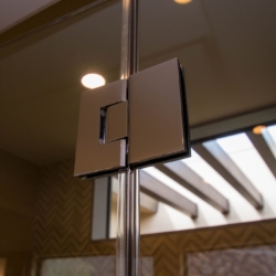Close-up of Frameless Hinge System in Shower Door Enclosure