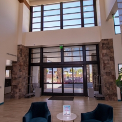Interior Clubhouse of Revel Nevada. Transom Windows (Above) with Auto Sliding Glass Doors. Complete system by A Cutting Edge Glass and Mirror of Las Vegas, Nrevada