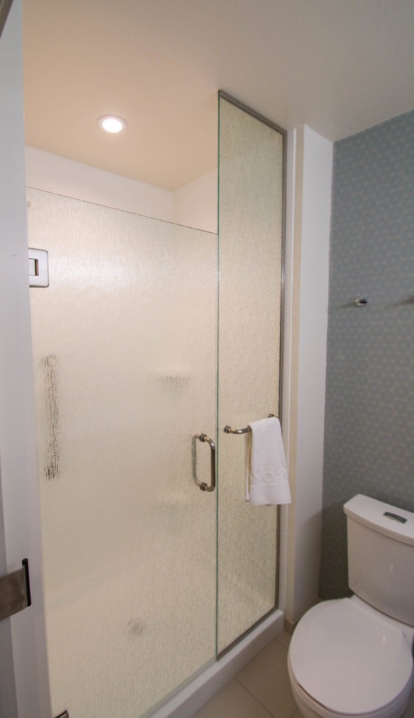 Home to Suites Shower Door Enclosure System by A Cutting Edge Glass and Mirror