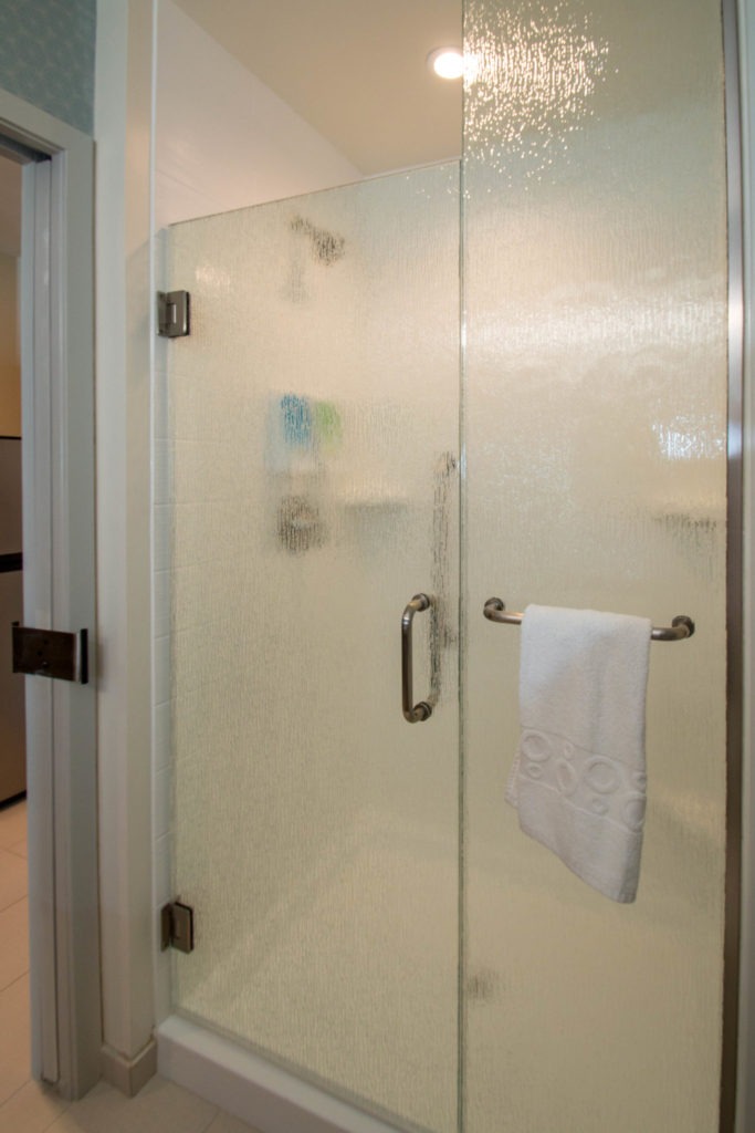 Home to Suites Shower Door Enclosure System by A Cutting Edge Glass and Mirror