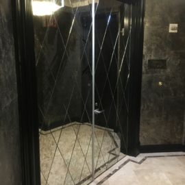 Diamond mirrors on front entryway