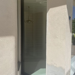 French aluminum door with storefront and low e glass enclosing patio