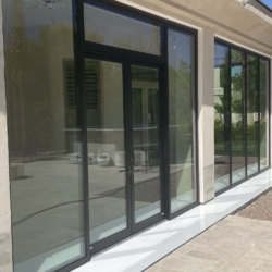 French aluminum door with storefront and low e glass enclosing patio
