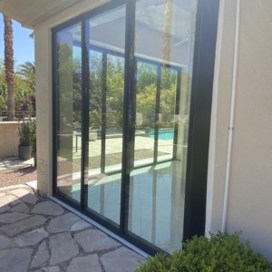 French aluminum door with storefront and low e glass enclosing patio